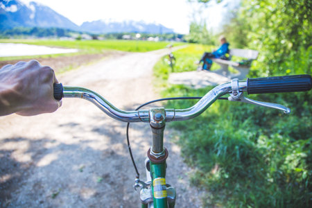 Closeup picture of a vintage bicycle handlebar and breaks outdoors, blurred backgroundの写真素材