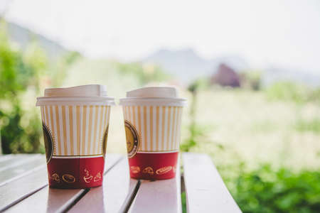 Coffee in paper cup for making a break, outdoorsの写真素材