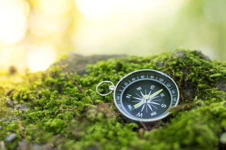 Vintage compass lying on the floor. Adventure and discovery concept.の写真素材