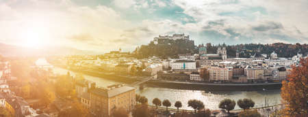 Panorama of Salzburg historic district at autumn time, colorful leaves and colors with sunshine, Austriaのeditorial素材