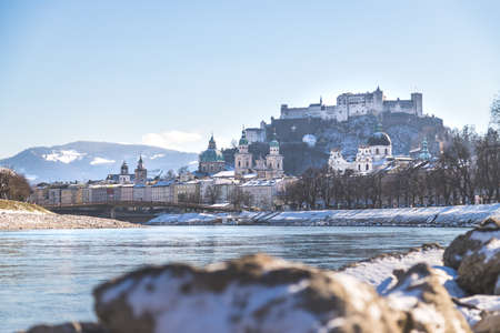 Panorama of Salzburg in winter, snow river bank, historical center, river Salzachのeditorial素材
