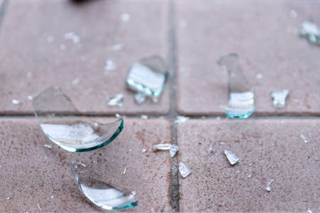 Piece of broken glass on the floor, wine bottleの写真素材
