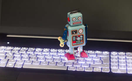 Symbol for a chat bot or social bot and algorithms, laptopの写真素材