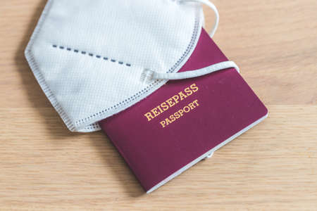 Close up of passport for traveling, airport, âReisepass Passportâ, ffp2 protection maskの写真素材