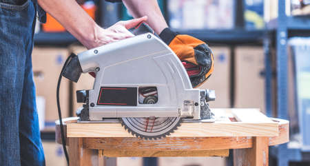Close up of circular saw, ready for sawing wood planksの写真素材