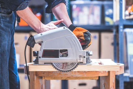 Close up of circular saw, ready for sawing wood planksの写真素材