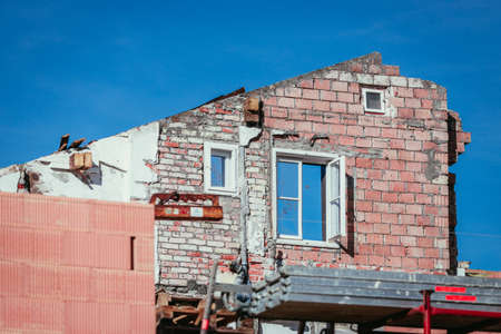 Close up of house front on a construction site, blue skyの写真素材