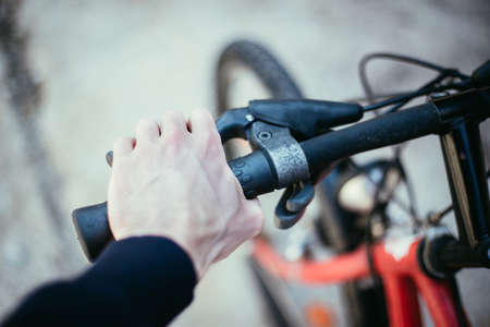 Closeup picture of a bicycle handlebar and breaks, bike repair, blurred backgroundの写真素材