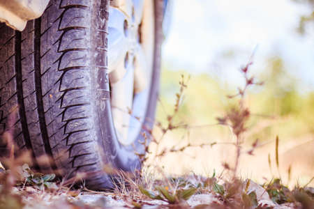 Car tire and sandy ground with text space, desertの写真素材