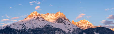Idyllic scenery with snowy mountains in the evening sun, Alps, Austriaの写真素材