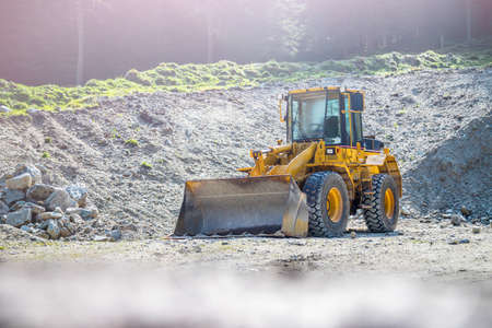 Wheel loader excavator is parking in a quarryの写真素材