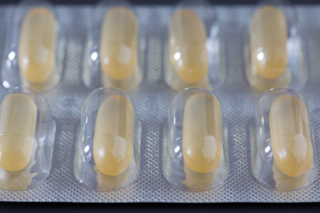 Pills / medicine lying on the gray table, flu seasonの写真素材