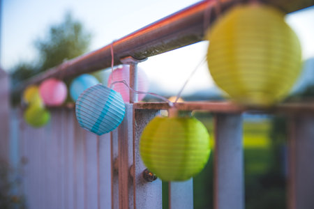 Colorful lampions outside, evening, garden partyの写真素材
