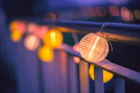 Colorful lampions outside, twilight hour, garden partyの写真素材