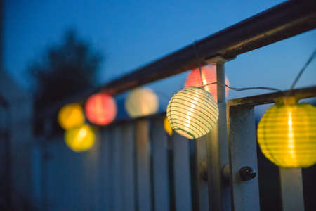 Colorful lampions outside, twilight hour, garden partyの写真素材