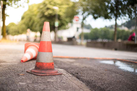 Traffic cone, road works in the city, blurryの写真素材