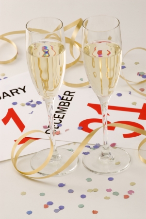 Two glasses of champagne and New Year's Eve decorationの写真素材