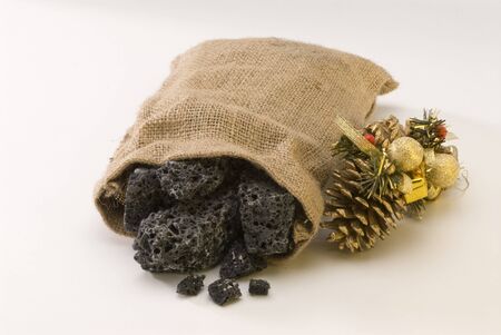 Sweet Christmas coal in a sack  Carbon de Reyes の写真素材