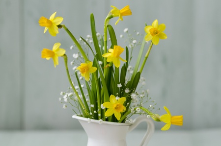 Narcissus in a white vase  Selective focus  Easter floral arrangement の写真素材