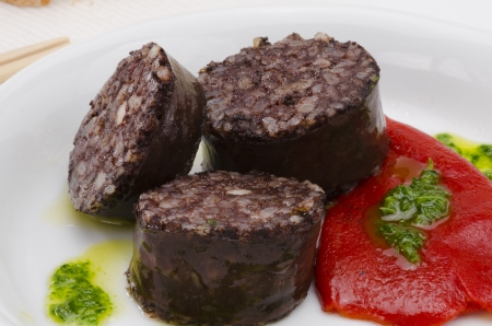 Spanish Tapas  Blood and rice sausage, Burgos Style, served  in a white plate  Morcilla de Burgos の写真素材
