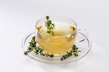Thyme Herbal Tea in a glass cup. Thymus vulgaris. Naturopathy. White Background.の写真素材
