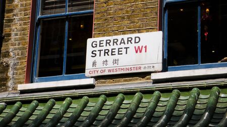 London, United Kingdom - July 22, 2013: Gerrard Street sign in English and Chinese. Chinatown. Soho District.のeditorial素材