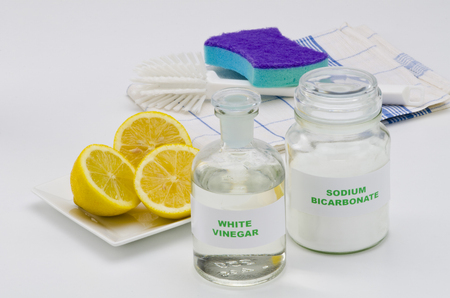 Organic cleaners. White vinegar, lemon and sodium bicarbonate.の写真素材