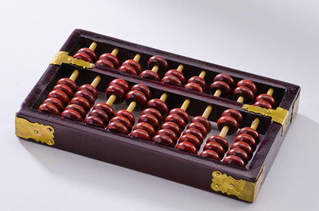 Old chinese abacus on white background.の写真素材