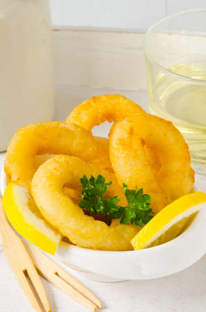 Spanish Tapas. Fried Squid Rings in a white bowl.  Calamares a la Romana.の写真素材