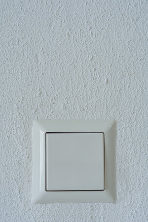 light switch on a white wallの写真素材