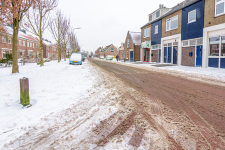 Koudekerk aan den Rijn, Netherlands - February 8, 2021: snow cleared main road in Koudekerk aan den Rijn.のeditorial素材