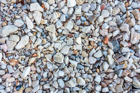 Pebble Beach Top View. Natural Stone Texture Background