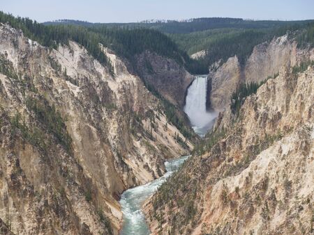Wide shot of the Lower Falls from the lookout point. It's one of the most popular attractions at Yellowstone National Park, Wyoming.の写真素材