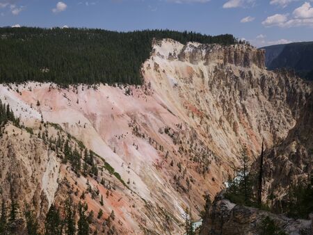 Steep canyon where the water from the Lower Falls flow at the bottom, Yellowstone National Park, Wyomingの写真素材