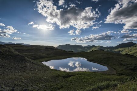 Panoramic view of idyllic summer landscape in the Rocky Mountains with a clear mountain lakeの写真素材