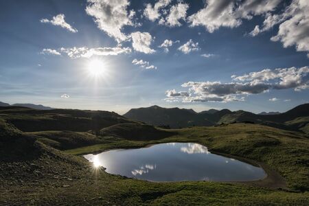 Panoramic view of idyllic summer landscape in the Rocky Mountains with a clear mountain lakeの写真素材