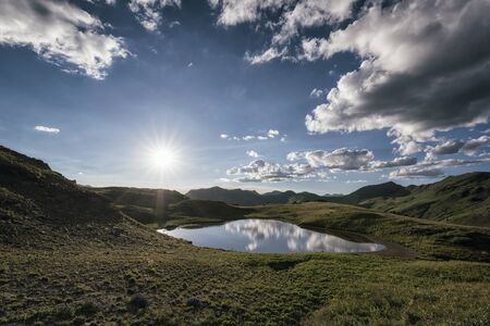 Panoramic view of idyllic summer landscape in the Rocky Mountains with a clear mountain lakeの写真素材