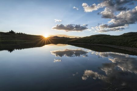 Panoramic view of idyllic summer landscape in the Rocky Mountains with a clear mountain lakeの写真素材