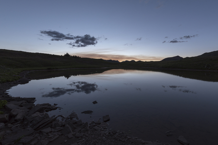 Panoramic view of idyllic summer landscape in the Rocky Mountains with a clear mountain lakeの写真素材