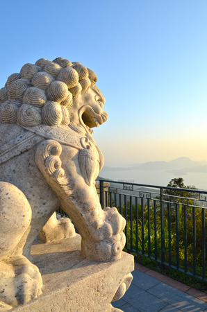 Chinese Imperial rock Lion, Guardian Lion facing the seaの写真素材