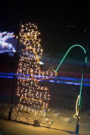 Christmas tree made of led lights on the street in the evening.の写真素材