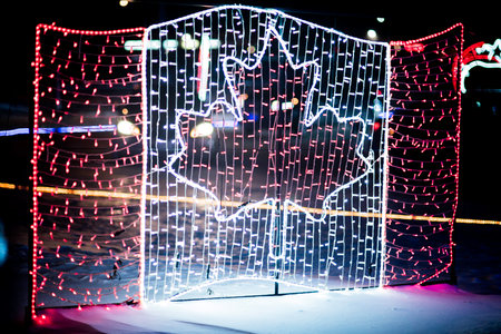 Map of Canada in a garland of red and white lights.の写真素材