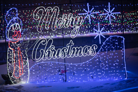 Merry Christmas and Happy New Year greeting card. Colorful lights on background.の写真素材