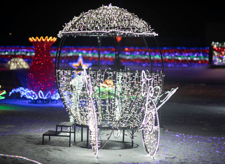 Christmas decoration in the form of a Christmas tree in the night cityの写真素材