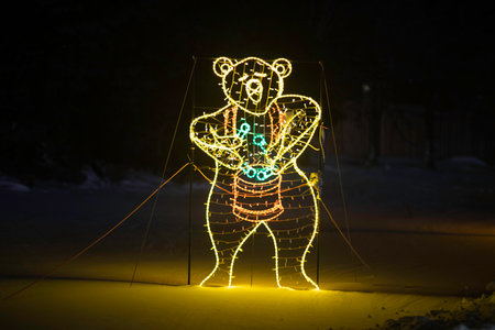 Christmas lights on the street in the form of a bear. New Year's illuminationの写真素材