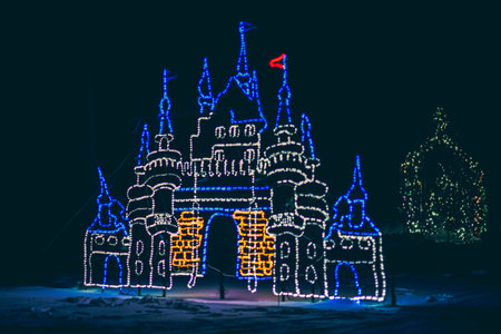 Illuminated castle in the snow at night. Christmas decoration.の写真素材