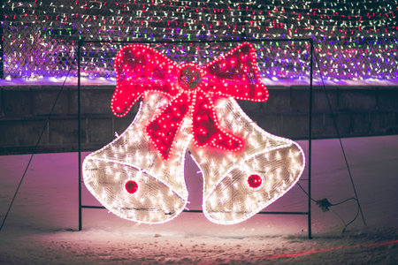 Christmas bells with lights in the city at night. Christmas background.の写真素材