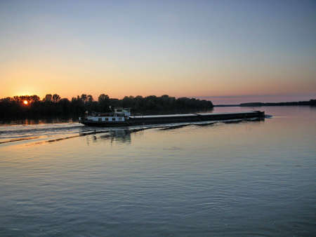 Ship sailing up the riverの写真素材