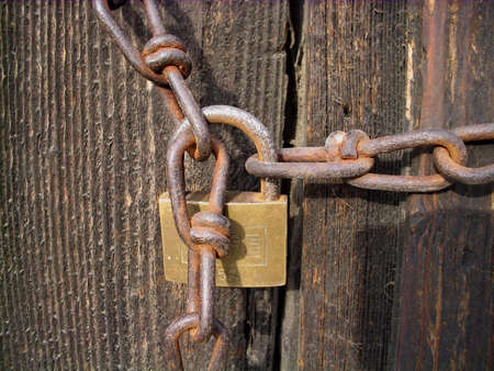 Old padlock and rusty chain