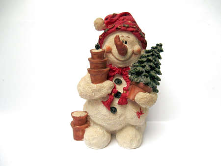 Snowman statues in different poses against white background の写真素材